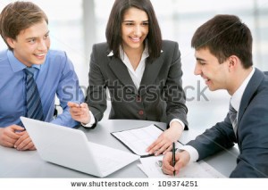 stock-photo-group-of-business-people-busy-discussing-financial-matter-during-meeting-109374251